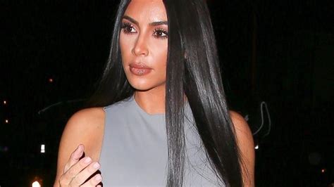 kim kardashian wears skin tight silver outfit on night out with sister kourtney