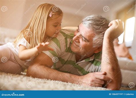 Grandpa With His Granddaughter Fun On Floor Stock Image Image Of