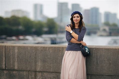 Beautiful Elegant Girl In Paris On The Background Of The Seine Stock