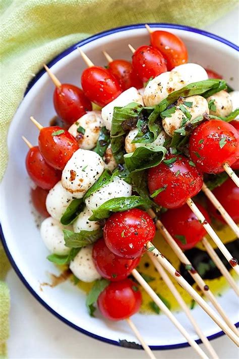 Caprese Salad Skewers Made With Tomatoes Mozzarella And Basil Leaves