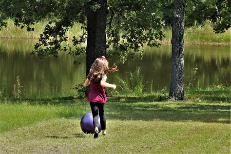 Little Girl Chasing Ball Free Stock Photo Public Domain Pictures