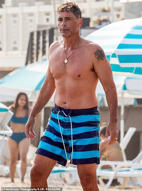 rob lowe 56 shows off his toned beach body and tan while shirtless on the sand in santa