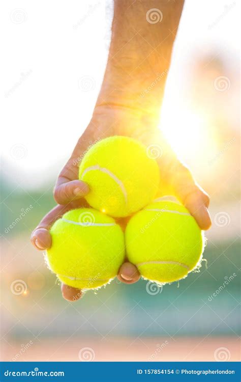 Photo Of Senior Man Holding Tennis Balls On Court Stock Photo Image