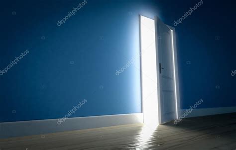 Light Shining Through Open Door In Dark Room With Blue Walls And Stock