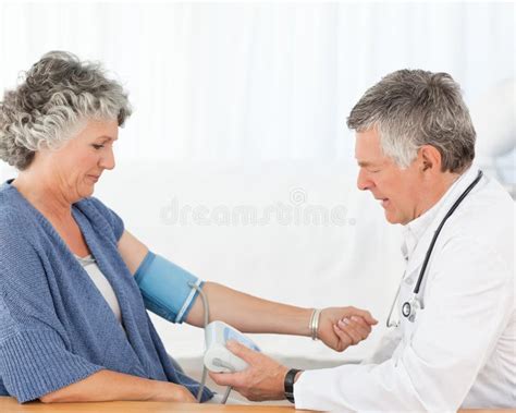 A Senior Doctor Taking The Blood Pressure Stock Image Image Of
