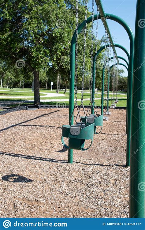 Empty Swings In A Playground Stock Image Image Of Empty Swings