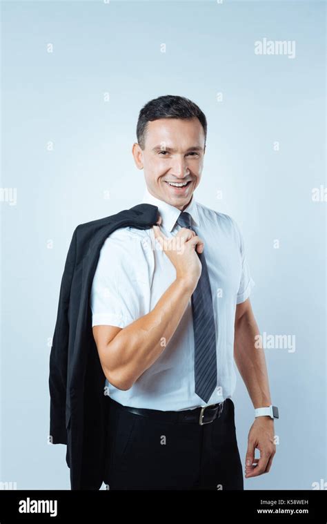 Delighted Smart Businessman Holding His Jacket Stock Photo Alamy