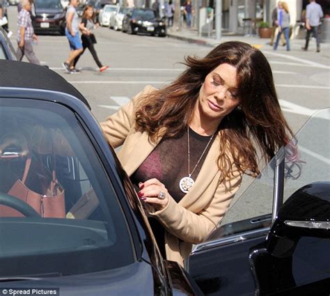 lisa vanderpump flashes her hot pink bra in a sheer black top as she leaves her beverly hills