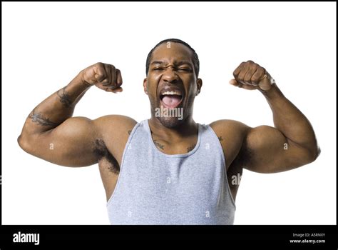 African American Man Flexing Arm Muscles Stock Photo Alamy