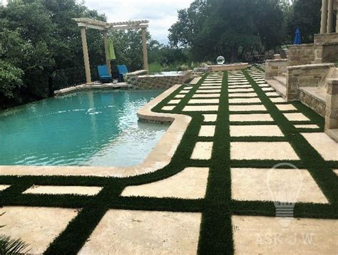 I am completely resodding my lawn and putting in pavers like this picture. Installing Artificial Grass Between Pavers | Artificial grass installation, Pool landscaping ...