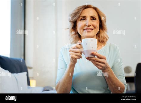 Smiling Short Haired Mature Lady Being Happy With Her Peaceful Morning