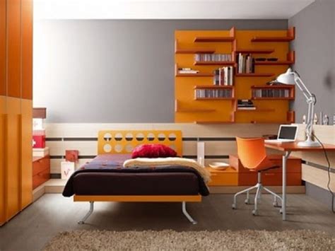 Small modern master bedroom in munich with orange walls, light hardwood floors, no fireplace and brown floor. Fantastic Orange Teen Bedroom Design | Blazzing House