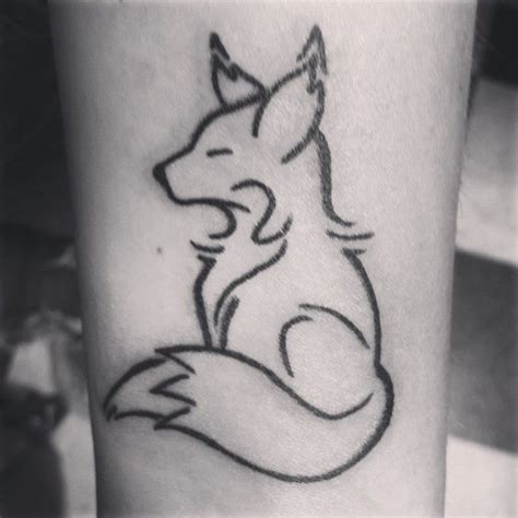 A Black And White Photo Of A Fox Tattoo