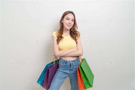 Portrait Beautiful Asian Woman Holding Shopping Bag On White Background