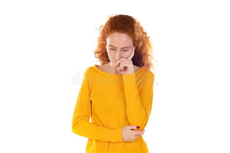 Portrait Of Pensive Redhead Girl Wearing A Yellow T Shirt Stock Image