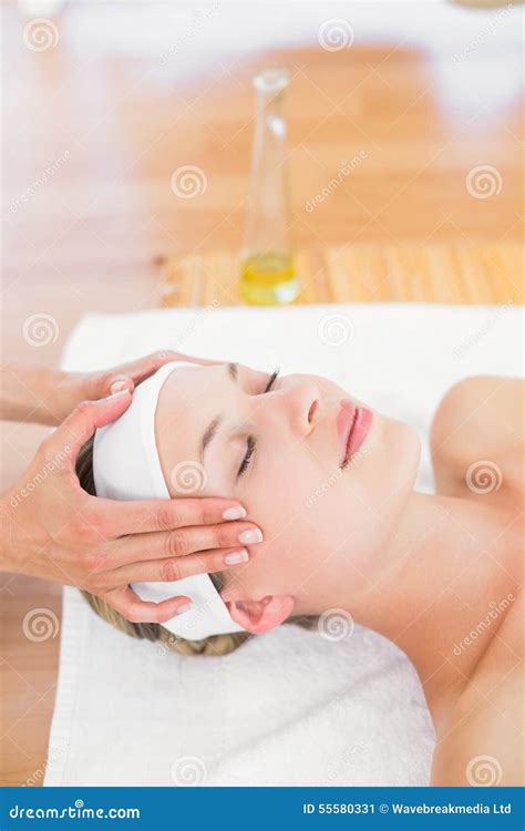 beautiful blonde relaxing on massage table smiling at camera stock image image of natural