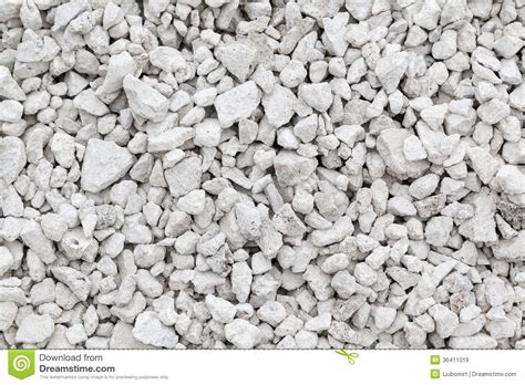 As a building material, an essential component of concrete (portland cement), as aggregate for the base of roads, as white pigment or filler in products such as toothpaste or paints, as a chemical feedstock for the production of lime, as a soil conditioner, and as a popular decorative addition to rock gardens. Crushed Limestone Royalty Free Stock Images - Image: 36411019