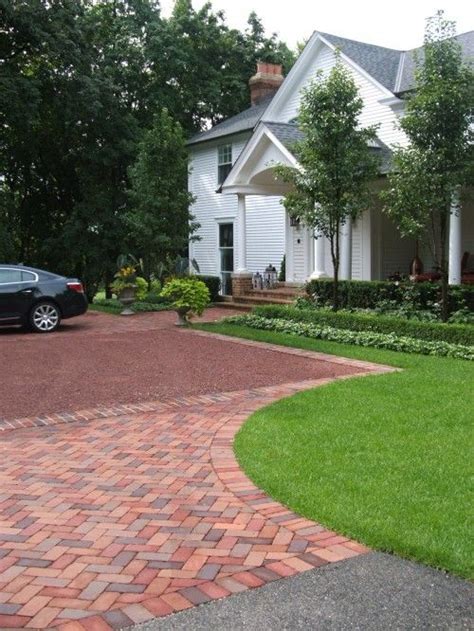 You can use permeable pavers for your entire driveway or just in areas that require better drainage. brick border, driveway, parking coury, entrycourt, gravel driveway | Landscape, Gardening ...