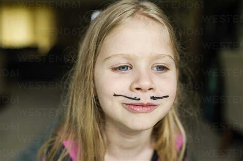 Girl With Mustache Face Paint At Home Stock Photo