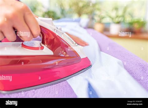 Woman Ironing With Iron Stock Photo Alamy