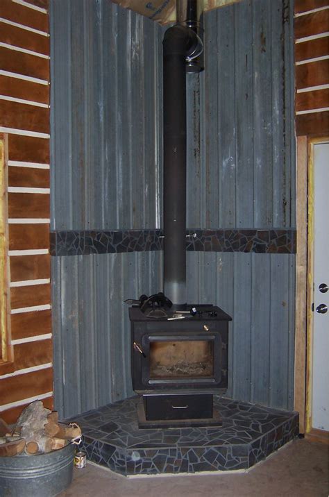 Since you have built a charming log cabin in the wilderness. Small Cabin Wood Stove Setup - Small Cabin Forum (3)