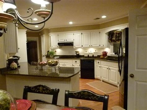 Best paint colors to go with dark brown cabinets. remodel complete, tropic brown granite, Dover White cabinet paint, Basket Beige wall color ...
