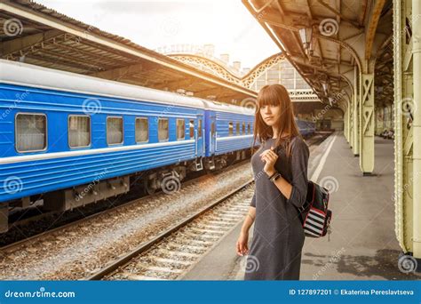 Beautiful Young Woman Standing On The Platform Of The Railway Station