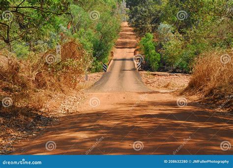 Dirt Road Crossing A Creek In The Outback Of Australia Stock Photo