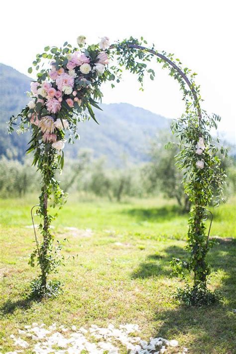 Beautiful Wedding Arch Featuring Flowers Of Pastel Pinks And Shades Of Green Pink Wedding