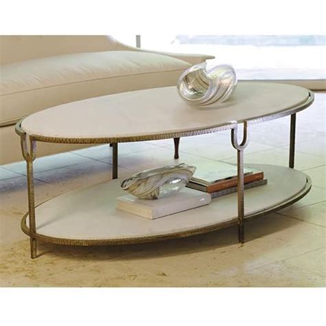 They offer valuable space for keeping remotes, reading materials an oval shaped marble top rests on a dark wood frame. Global Views Iron and Stone Oval Coffee Table | Oval ...