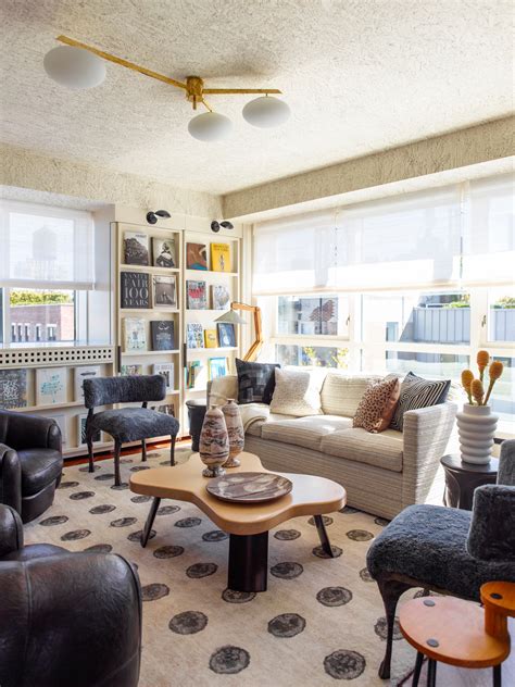 The city of boston is our dining room. / photo by erin little in the library, a vintage quilt and a kelly wearstler lumbar pillow lend personality to an rh sleeper sofa. NYC Penthouse by Kelly Wearstler, Inc. on 1stdibs