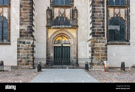 Thesis Door At The Castle Church In Wittenberg On The Door Is The