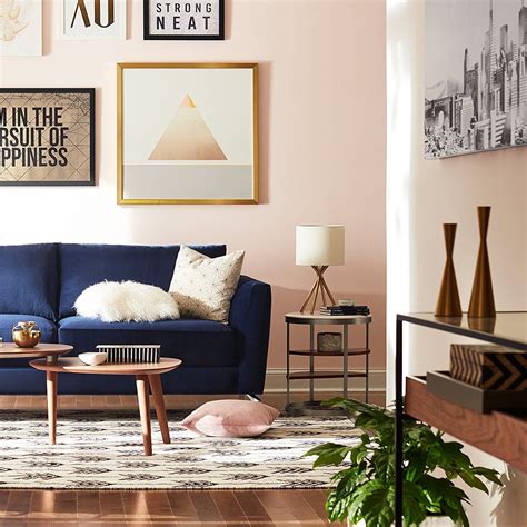 Blush Wall Color With A Navy Blue Couch Giving The Look A Perfect Calm