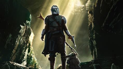 1366x768 The Mandalorian Bounty With Baby Yoda At His Side Laptop Hd