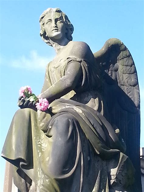 Angel Statue With Flowers Taken At Glasgow Necropolis Scotland