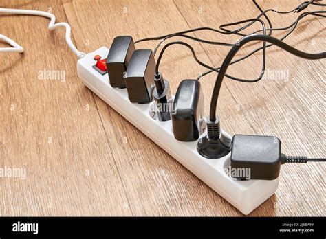 Electrical Power Strip Overloaded With Multiple Electrical Cords