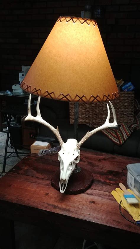 The brown leather sofa seats look very classy. Lamp I made utilizing a deer skull. | Man cave lamps ...