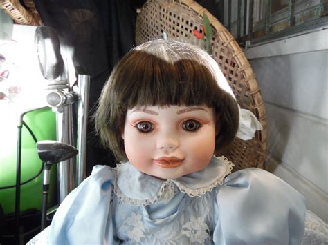 Vintage Porcelain Doll Glass Eyes Signed Antiques Board