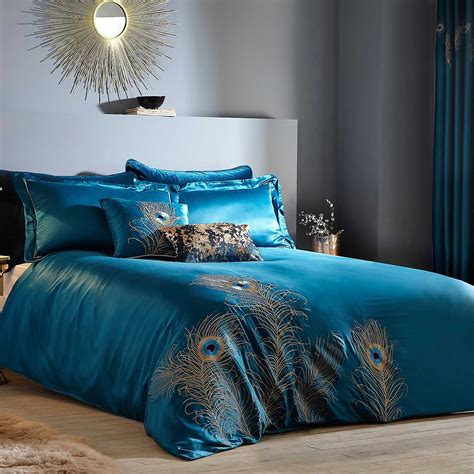 Next day delivery & free returns available. Peacock Feather Embroidered Teal Duvet Set | Teal duvet ...