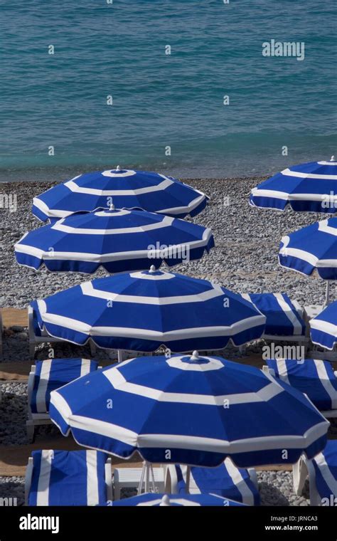 Blue Beach Umbrellas On Beach Nice France Stock Photo Alamy