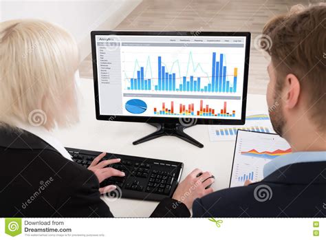 Businesspeople Analyzing Graph On Computer Stock Image - Image of ...