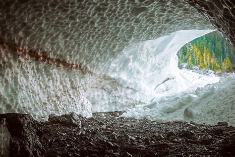 Inside View Of Enormous Natural Ice Cave In Snowy Forest By Stocksy