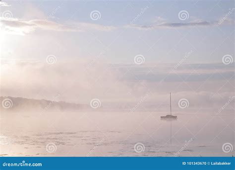 Morning Mist Over Lake With Sailboat Stock Photo Image Of Sailboat