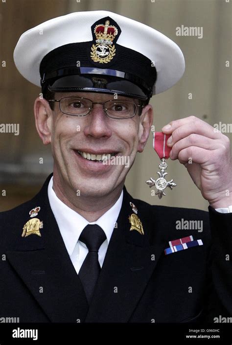 Royal Navy Chief Petty Officer Andrew Moss With His Mbe After Receiving