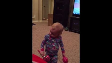 a sassy 2 year old doesn t like daddy playing her maracas watch how she lets him know madly odd