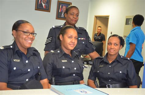 Officers Of The Trinidad And Tobago Police Service Smile For A Photo