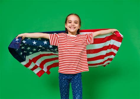 Happy Child Girl With Flag Of United States Of America Usa On Green
