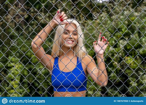 A Young Lovely Blonde Model Works Out Outdoors While Enjoying A Summers