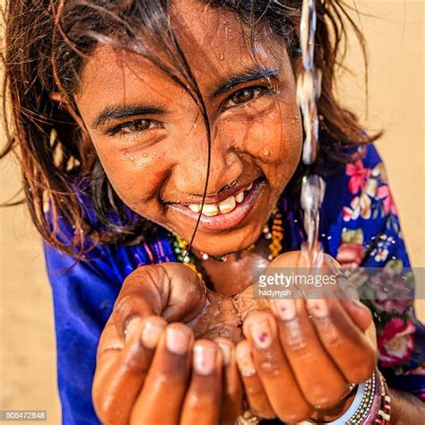 Indian Kid Drinking Water Photos And Premium High Res Pictures Getty
