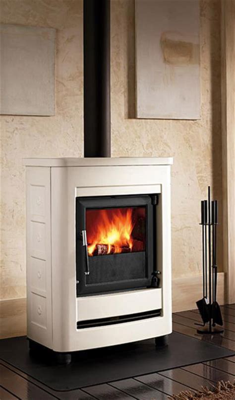 A heavy cast iron door with air washed ceramic glass allows a magnificent view of the burning fire that will enhance any hearth setting. Calore - Free Standing, Wood Burning Fireplaces.